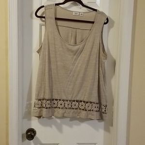 Sleeveless knit top with crocheted edging on botto